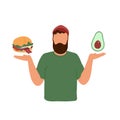 Young man choosing between burger and avocado